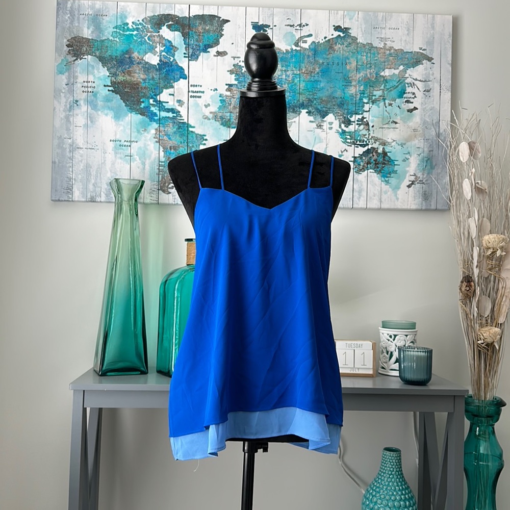Flowy blue shirt with double layer of a lighter shade. Express.